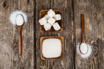 Bowls with sugar and two wooden spoons