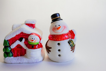 Smile snowman and the red house, Christmas decorations, special holiday in a year.
