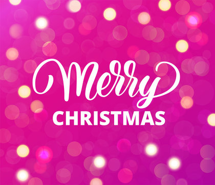 Merry Christmas text. Holiday greetings quote. Pink background with sparkling glowing lights. Bokeh effect.