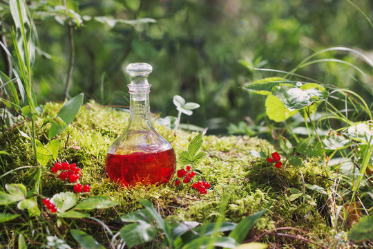 Magic potion in bottle in forest