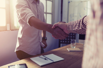 businessman handshaking process after successful deal of business meeting,Close up image handshake of business partnership