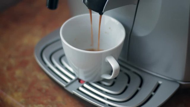 coffee machine pours coffee