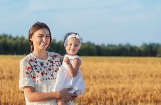 mother and daugther in field