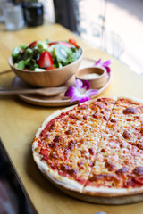 Hot pizza slice with melting cheese