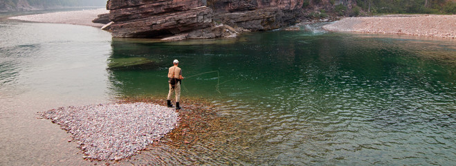 Fly fishing at the confluence of the Flathead and Spotted Bear Rivers in the Bob Marshall...
