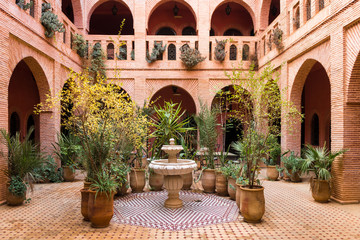beautiful garden inside moroccan courtyard, marrakech - obrazy, fototapety, plakaty
