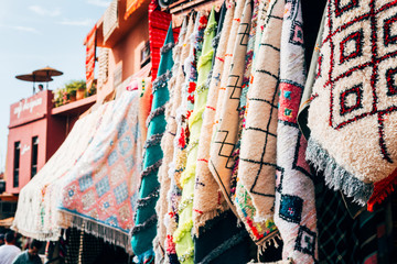 colorful carpets hanging at moroccan shops, marrakech