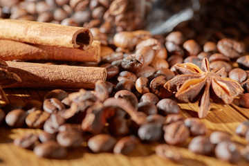 Obraz na płótnie Canvas Aroma coffee chocolate cookies and spices on the wooden table. Dark wooden background. Top view. Close. Closeup.