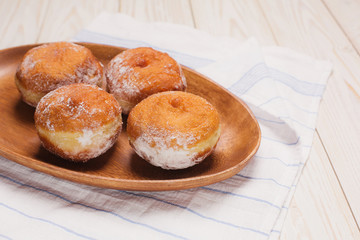 jewish holiday Hanukkah plate with tasty donuts