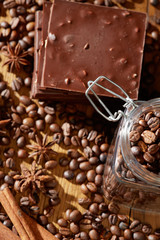 Aroma coffee chocolate cookies and spices on the wooden table. Dark wooden background. Top view. Close. Closeup.