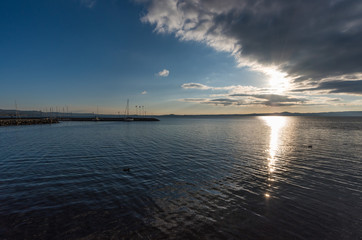 Bolsena lake (Italy) - The lake front and the port of Bolsena medieval town, at sunset