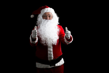Portrait of Santa Claus standing with thumbs up isolated on white background