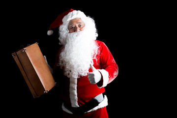 Happy traditional Santa Claus with gift box isolated on background.