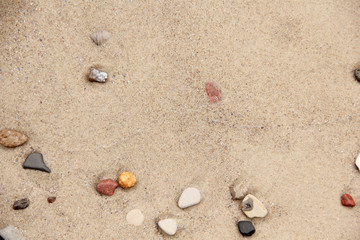 Fototapeta na wymiar Sand Strand Hintergrund Steine Kiesel Kieselsteine Textur