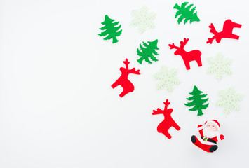 Christmas composition. Christmas tree, dear, Santa Claus on white background. Flat lay, top view