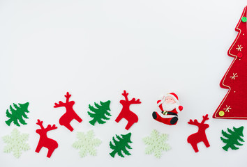 Christmas composition. Christmas tree, dear, Santa Claus on white background. Flat lay, top view
