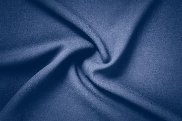 Fototapeta na wymiar Texture, background, pattern. Gray fabric with a pastel blue tin