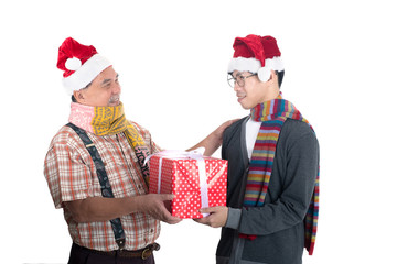 Close up of dad gives his son a gift in red box isolated on white background.