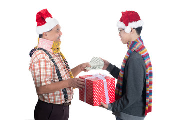 Close up of dad gives his son a gift in red box isolated on white background.