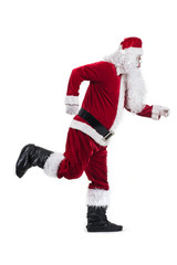 Happy traditional Santa Claus running isolated on white background.