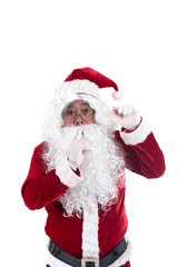 Funny santa is keeping forefinger by his lips isolated on white background. Secrets surprise celebration concept.