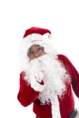 Funny santa is keeping forefinger by his lips isolated on white background. Secrets surprise celebration concept.