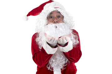 Happy traditional Santa Claus isolated on white background. Portrait of Santa Claus blows something away isolated on white background.
