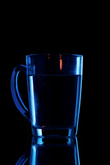water on a glass on dark background.