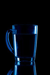water on a glass on dark background.