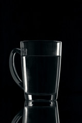 water on a glass on dark background.