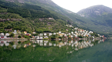 Fototapeta premium View of colorful wooden houses on a hill in Odda on the Sorfjord, Norway