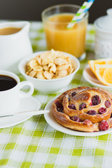 Cup of coffee, baking, muesli and orange juice