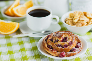 Cup of coffee, muesli, baking and orange juice