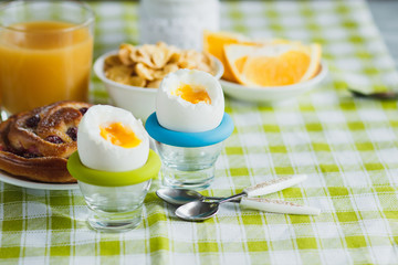 Soft boiled chicken egg, baking, muesli and orange juice
