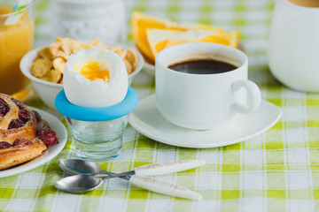 Soft boiled chicken egg, coffee, baking, muesli and orange juice