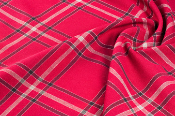  texture, pattern. Scottish tartan pattern. Red and black wool plaid print as background. Symmetric...