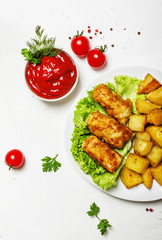 Fish and chips with tomato sauce ketchup, white background, top view