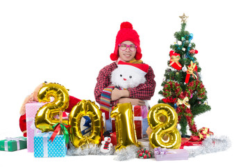 happy young asian man with gift box around and clebreat letter 2018 sign isolated on white.