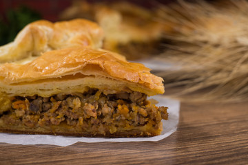 Sliced succulent meat pie with mushrooms and meat
