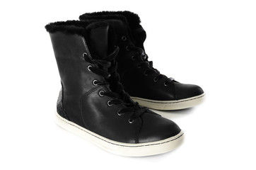 Womens black  leather sneakers. Winter fashion shoes isolated on white