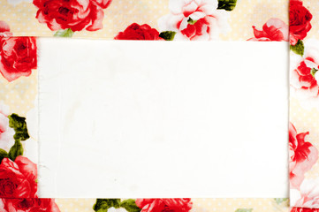 Texture, background, pattern. Silk fabric is beige with red roses. Place for text on white background