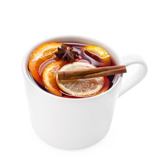 Cup of hot wine with spices on white background