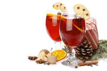 Cup of hot wine with spices on white background