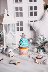 Christmas delicious cupcakes decorated with a silvery star. Christmas background.
