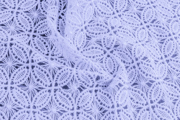 decorative lace with pattern. Blue pastel colors of lace fabric. Template for wedding, invitation or greeting card with blue lace background. Close-up of a wedding lace texture