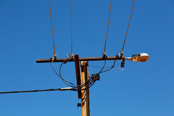 power line with electrical pole in the clear sky