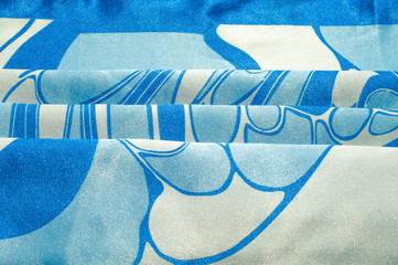 Texture, background, pattern. A woman's silk handkerchief. Shawl abstract pattern, blue patterns on...