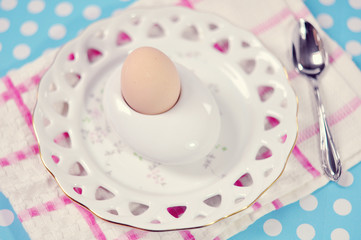 Egg with Spoon on vintage plate