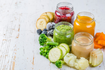 Colorful baby food purees in glass jars