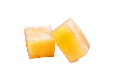 Yacon slices on white background